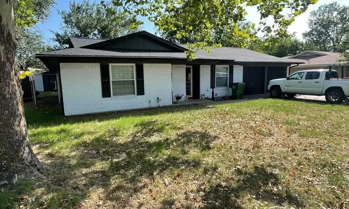 Professional roofing crew working on a residential roof in Los Lunas